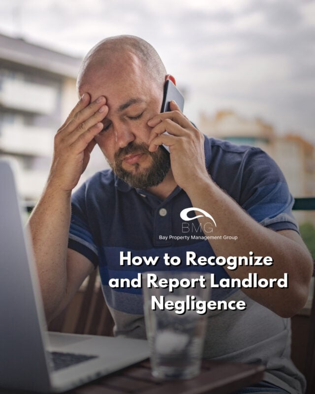 Man stressed while talking on phone at a laptop, representing landlord negligence concerns