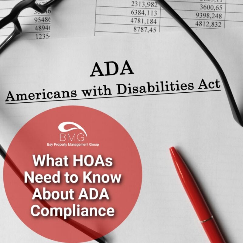 A document titled "ADA Americans with Disabilities Act" with a red pen and glasses placed on top. A red circle overlay contains the text, "What HOAs Need to Know About ADA Compliance," under the Bay Property Management Group logo.