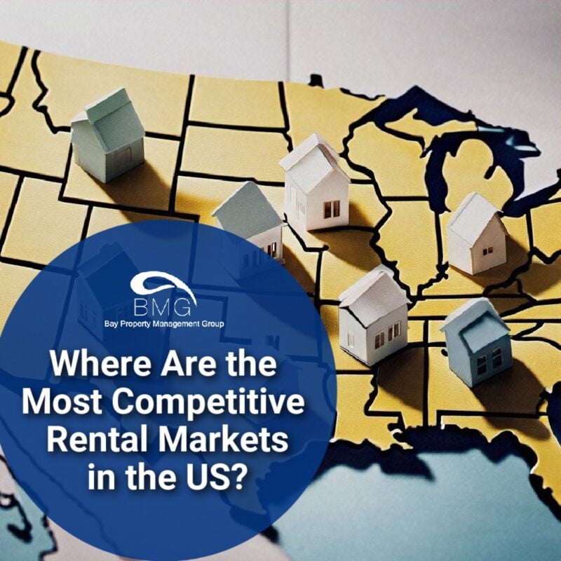A map of the United States with small model houses placed on various regions. A blue circle overlay reads, "Where Are the Most Competitive Rental Markets in the US?" under the Bay Property Management Group logo.