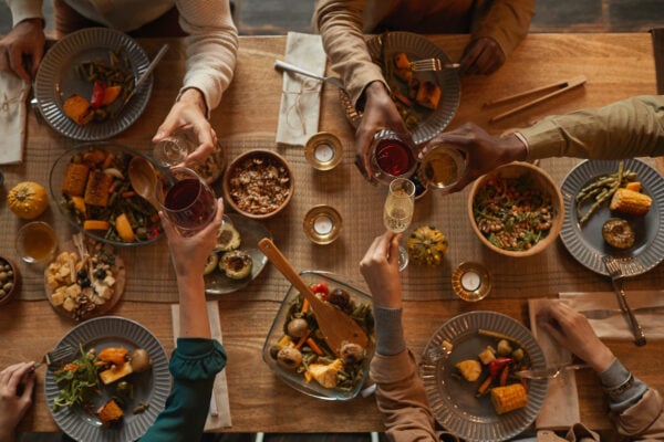 Group of people sharing a spread of food on a table