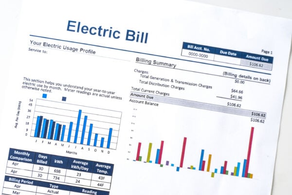 Close-up of an electricity bill showing energy usage, billing summary, and monthly charges.