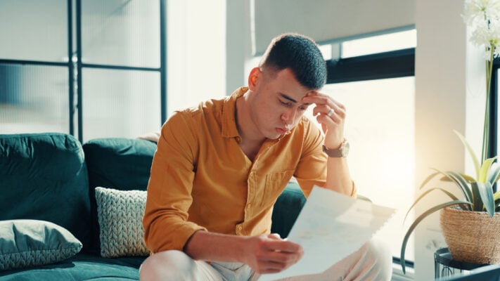 Landlord reviewing paperwork during a difficult tenant situation
