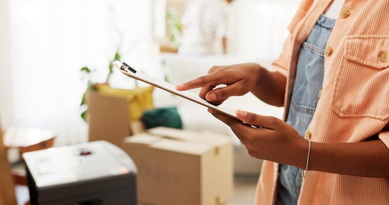 Landlord reviewing rental property inspection checklist during move-in or maintenance check