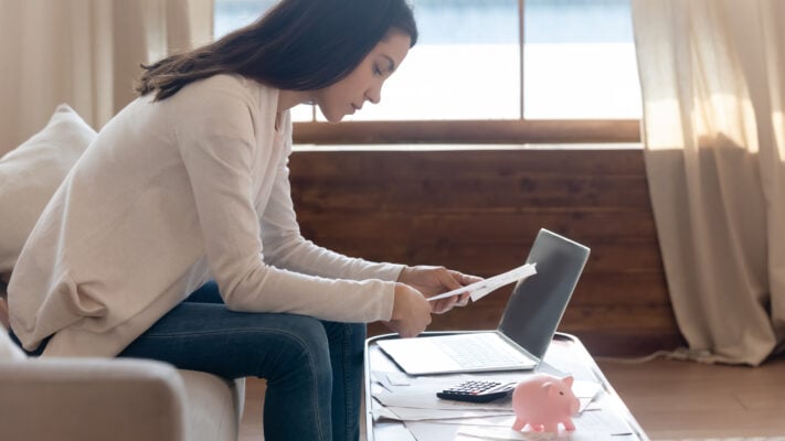 Renter looking through paperwork while deciding what to do after a co-tenant leaves