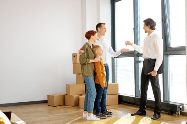 Family moving into a new rental property after relocating