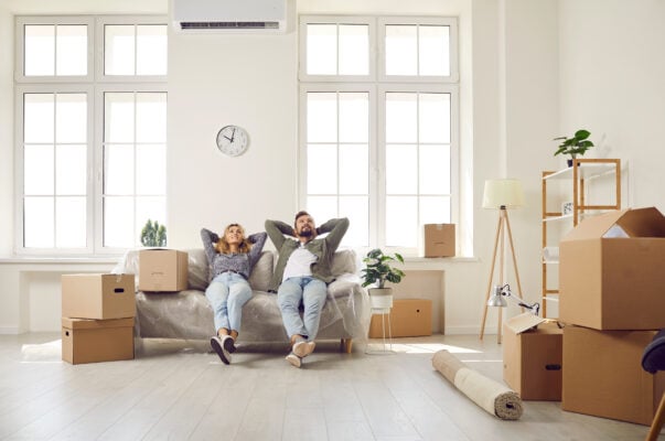 Tenants relaxing in their new apartment after moving in and settling into their new home.