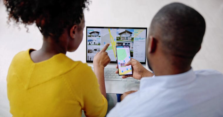 Couple reviewing apartment listings online while searching for rentals in Philadelphia
